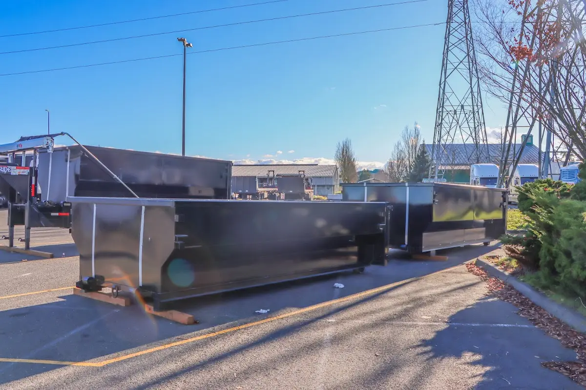 Roll-off dumpster ready for waste disposal at job site for Concrete Dumpster Rental in Hadley